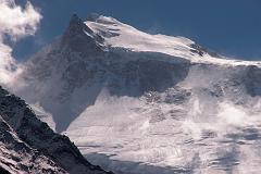 
A half hour before Larkya Phedi, through a break in the mountains caused by Larkya Glacier, I had a sensational view of the full width of the north face of Manaslu from the East Pinnacle to the Main Summit. The normal route of ascent goes to the right and then crosses the large plateau to the summit.
